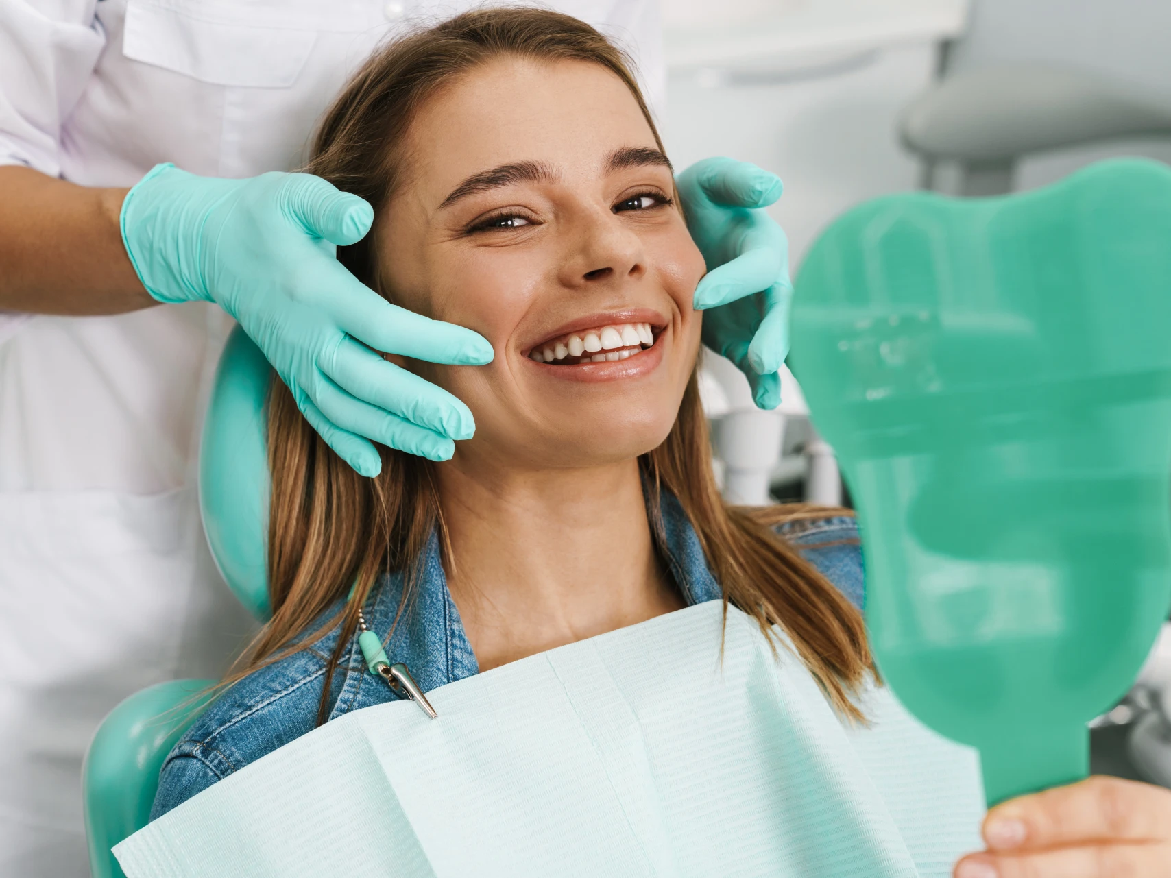 young woman smiling after professional teeth cleaning Monroe, CT