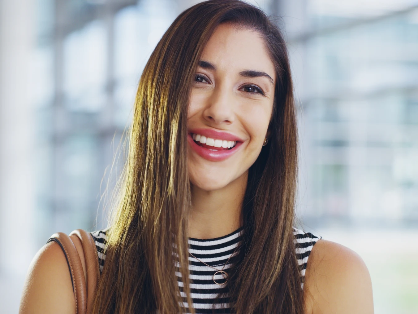 woman smiling after porcelain veneers Monroe, CT